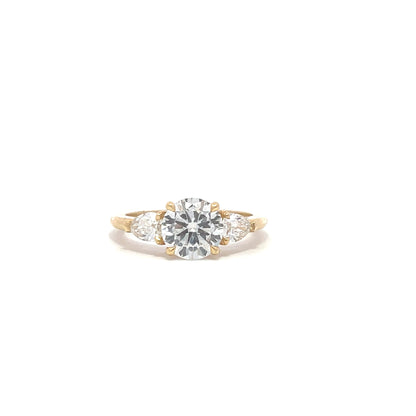 Round diamond trilogy engagement ring