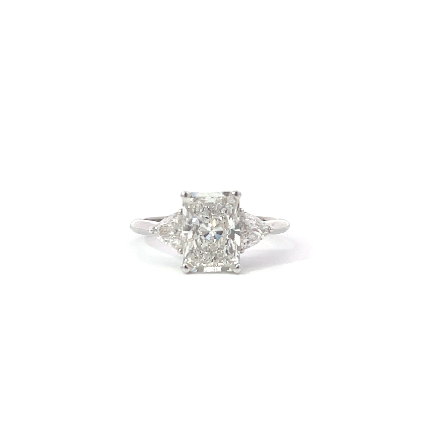 Radiant trilogy engagement ring