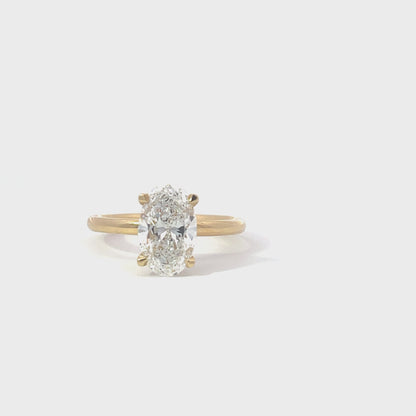 Laboratory grown hidden halo oval diamond ring