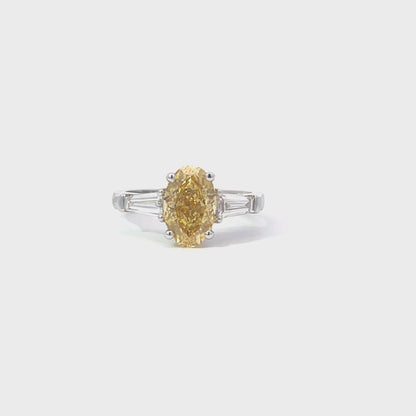 Laboratory grown trilogy fancy vivid yellow diamond ring